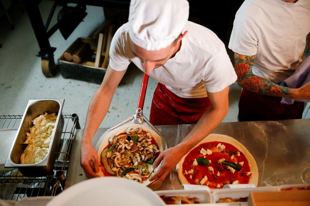 File picture shows pizza being prepared inside the Apollo Pizzeria, in London, January 22, 2019. u00e2u20acu201d Reuters pic