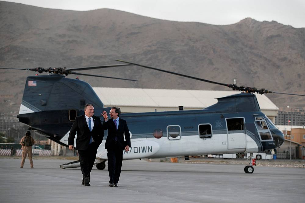 Secretary of State Mike Pompeo (left) walks from a helicopter with US Ambassador to Afghanistan John Bass after an unannounced visit to Kabul, Afghanistan June 25, 2019. u00e2u20acu201d Jacquelyn Martin/Pool pic via Reuters