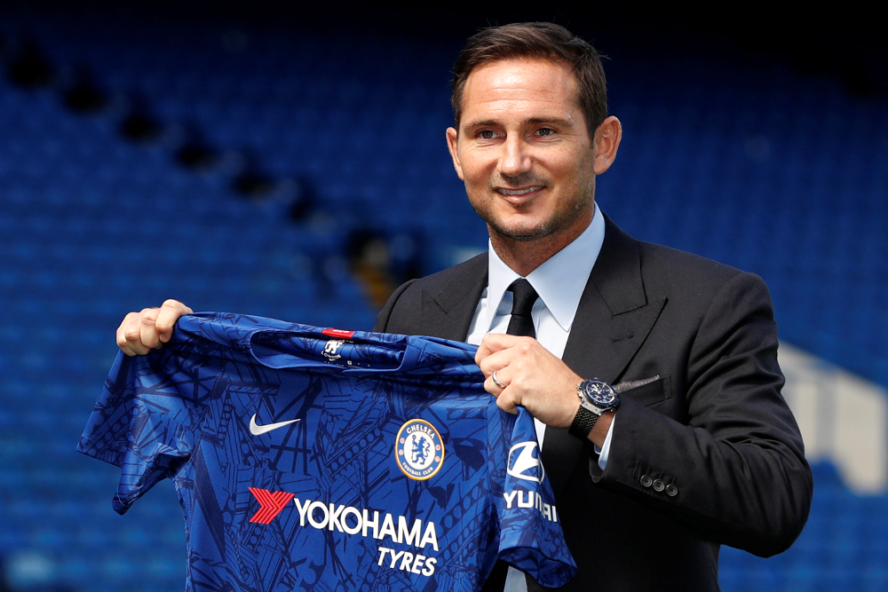 New Chelsea manager Frank Lampard holds up a shirt during the press conference at Stamford Bridge, London July 4, 2019. u00e2u20acu201d Picture by Action Images via Reuters/John Sibley