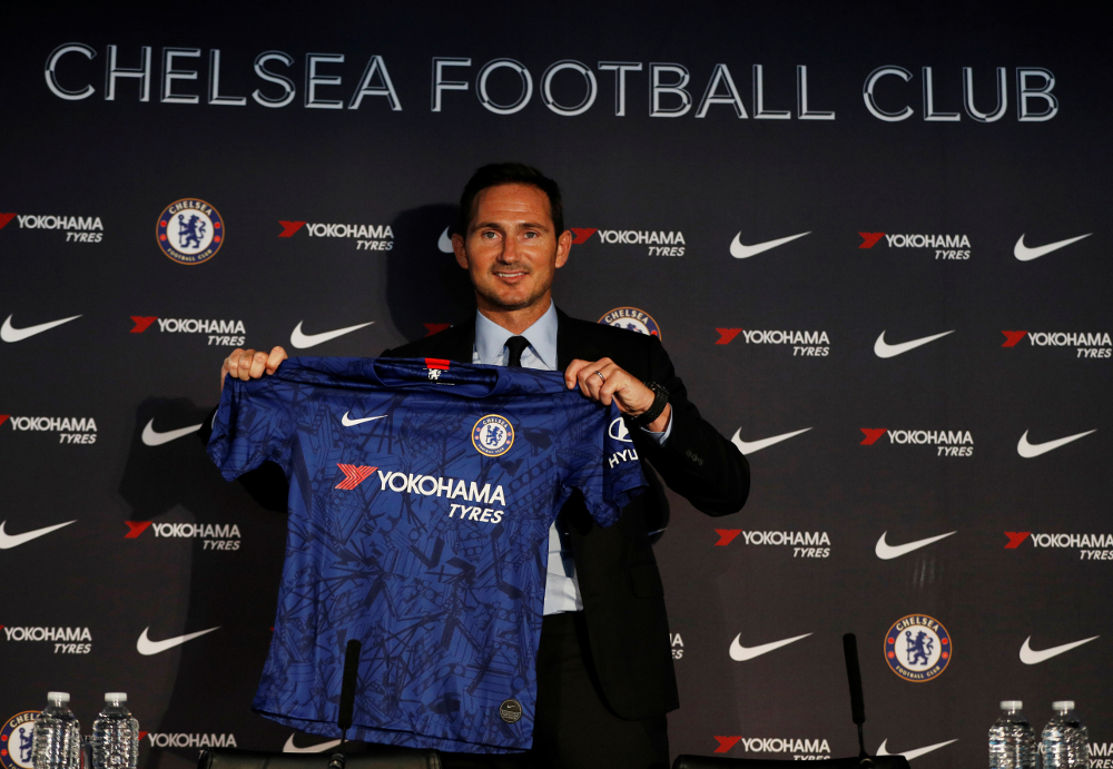 New Chelsea manager Frank Lampard holds up a shirt during the press conference at Stamford Bridge, London July 4, 2019. u00e2u20acu201d Picture by Action Images via Reuters/John Sibley