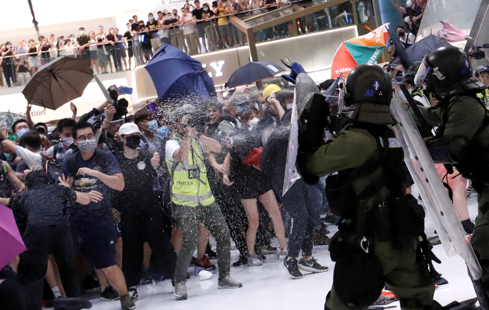 Riot police use pepper spray to disperse pro-democracy activists inside a mall after a march at Sha Tin District of East New Territories, Hong Kong July 14, 2019. u00e2u20acu201d Reuters pic