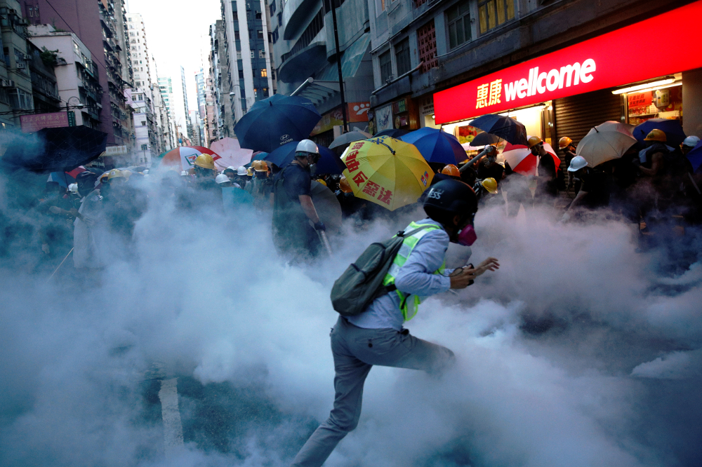 Demonstrators clash with police during a protest against police violence during previous marches, near China’s Liaison Office, Hong Kong July 28, 2019. — Reuters pic