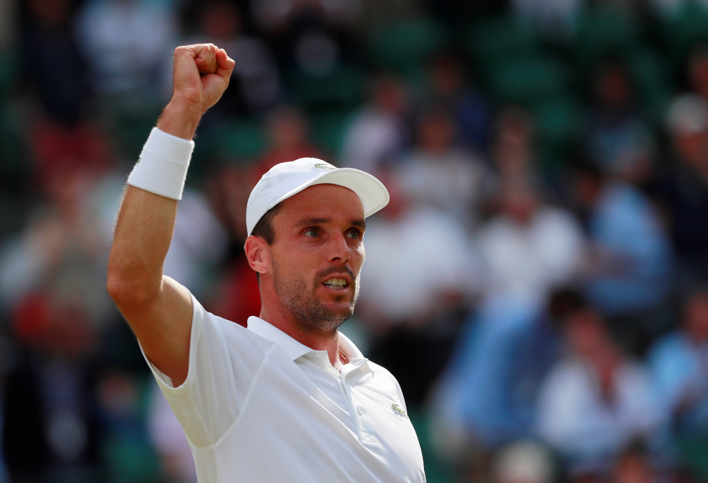 Spainu00e2u20acu2122s Roberto Bautista Agut celebrates after winning his Wimbledon quarter final match against Argentinau00e2u20acu2122s Guido Pella at the All England Lawn Tennis and Croquet Club, London July 10, 2019. u00e2u20acu201d Reuters pic