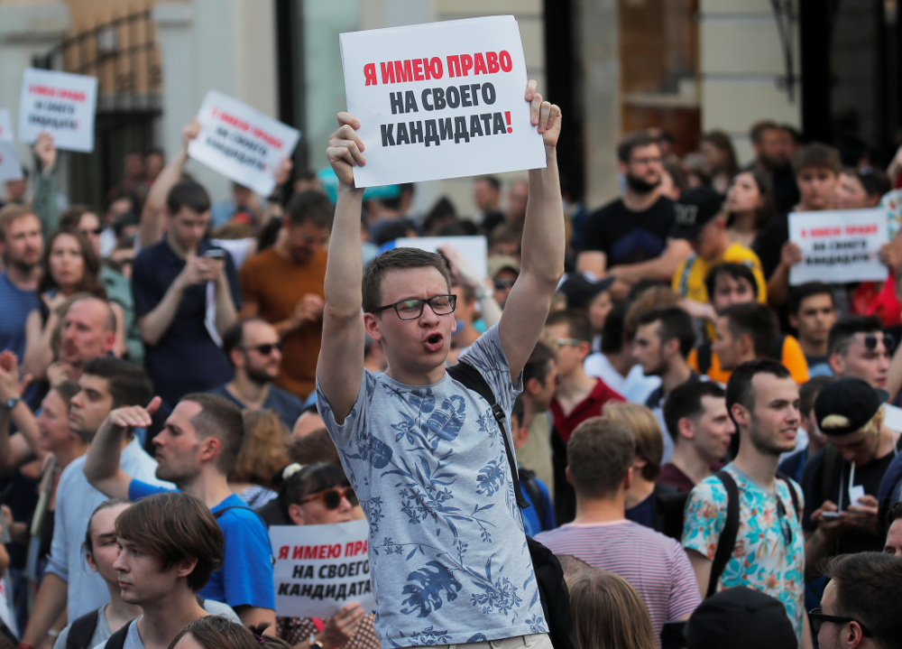 People take part at a rally calling for opposition candidates to be registered for elections to Moscow City Duma, the capitalu00e2u20acu2122s regional parliament, in Moscow July 27, 2019. The placard reads: u00e2u20acu02dcI have a right to my candidateu00e2u20acu2122. u00e2u20acu201d Reuters pic