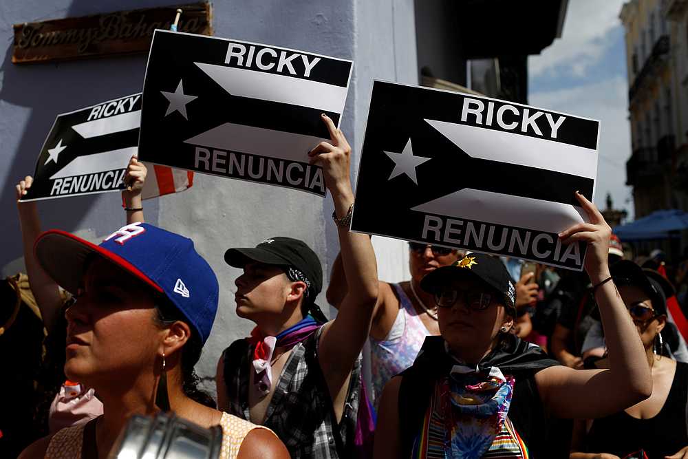 Women hold black and white Puerto Rican flags that reads 'Ricky resign' during ongoing protests calling for the resignation of Governor Ricardo Rossello in San Juan, Puerto Rico July 20, 2019. u00e2u20acu201d Reuters pic
