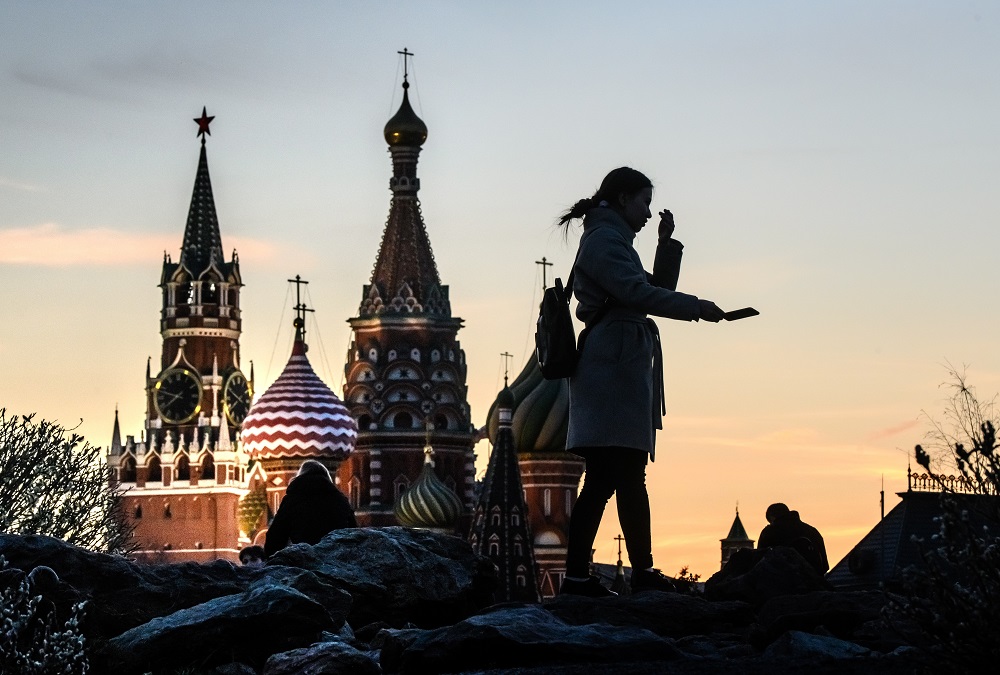 In this file photo taken on April 19, 2019 a woman takes a selfie in front of the Kremlin and St Basil Cathedral at sunset in Moscow. u00e2u20acu201d AFP pic      