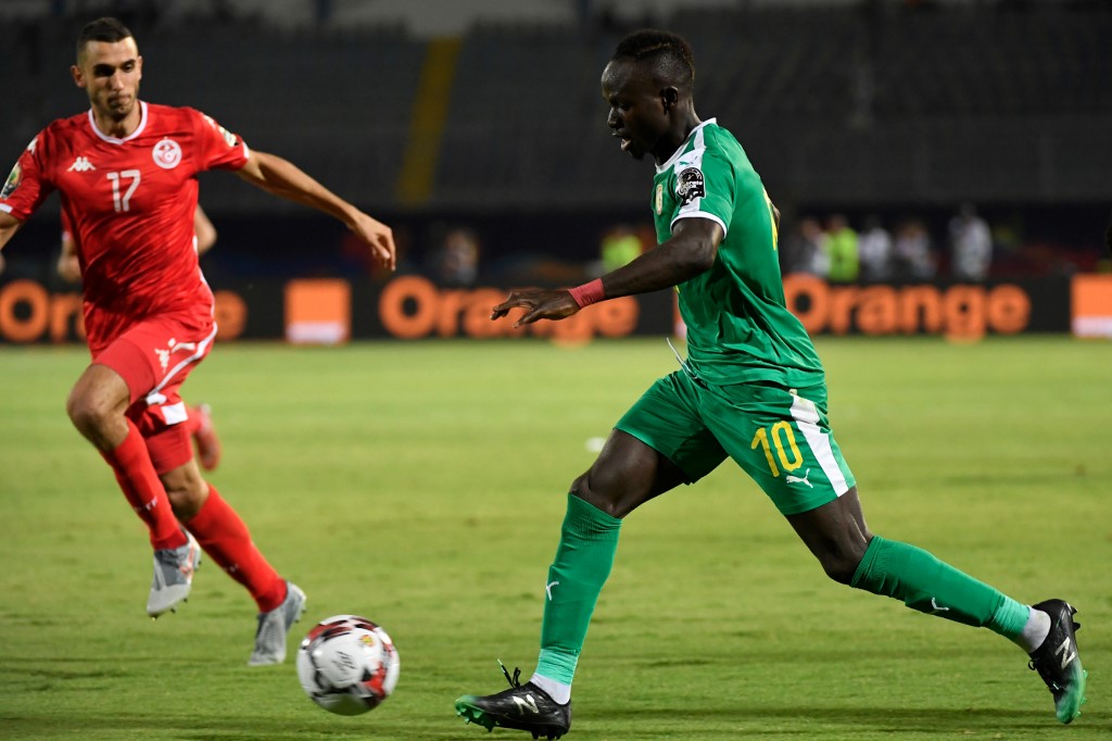 Tunisiau00e2u20acu2122s midfielder Ellyes Skhiri (left) fights for the ball with Senegalu00e2u20acu2122s forward Sadio Mane during their 2019 Africa Cup of Nations (CAN) Semi-final match at the 30 June stadium in Cairo, July 14, 2019. u00e2u20acu201d AFP pic