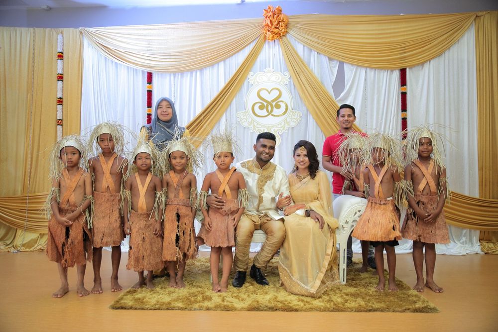 Samuel Isaiah and his wife on their wedding day with his orang asli students in 2017. u00e2u20acu201d Picture from Twitter/Samuel Isaiah