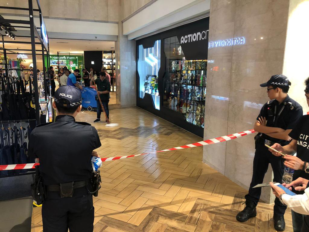 Police on the scene outside an Action City store at the Basement 2 level of the Orchard Road mall July 14, 2019. u00e2u20acu201d Picture by Najeer Yusof/TODAY