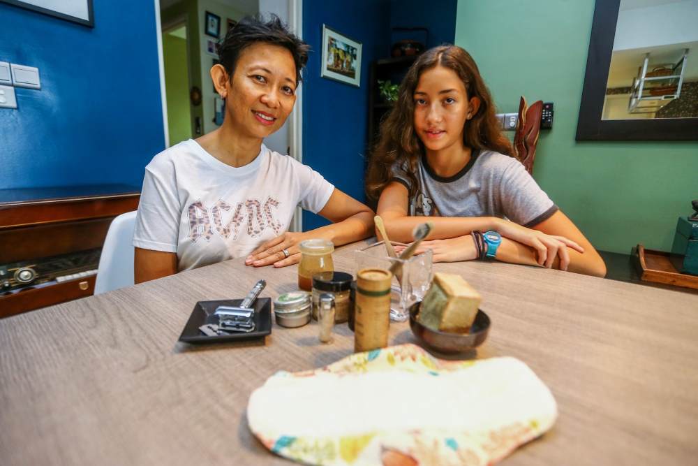 Mareena (left) and Kerschot showing some of the environmentally-friendly bathroom products they have at home. 