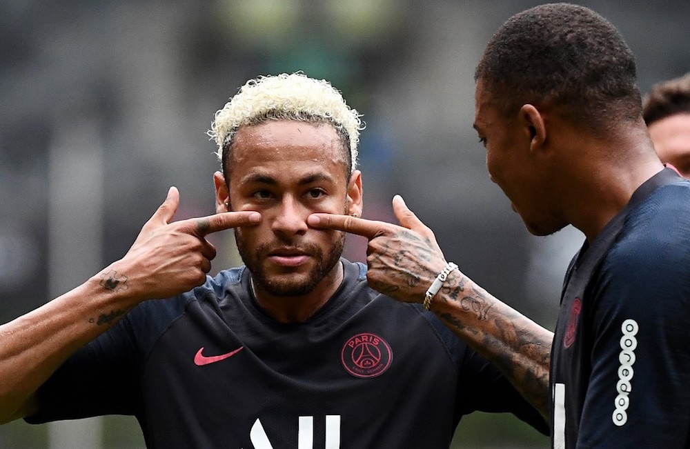 Paris Saint-Germain players Neymar and Kylian Mbappe share a joke during a training session at the Shenzhen Universiade Stadium in Shenzhen August 2, 2019. u00e2u20acu201d AFP pic