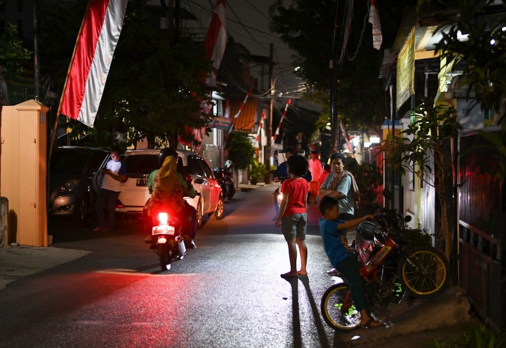 Residents stand in the street after a strong earthquake hit the area around Jakarta August 2, 2019. u00e2u20acu201d AFP pic