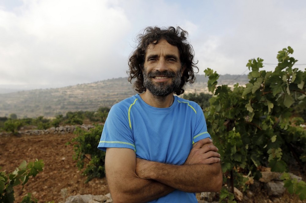 Nachum Pachenick is pictured in the yard of his home in Sde Boaz outpost located near the Neve Daniel settlement in the Israeli-occupied West Bank on August 6 2019. — AFP pic