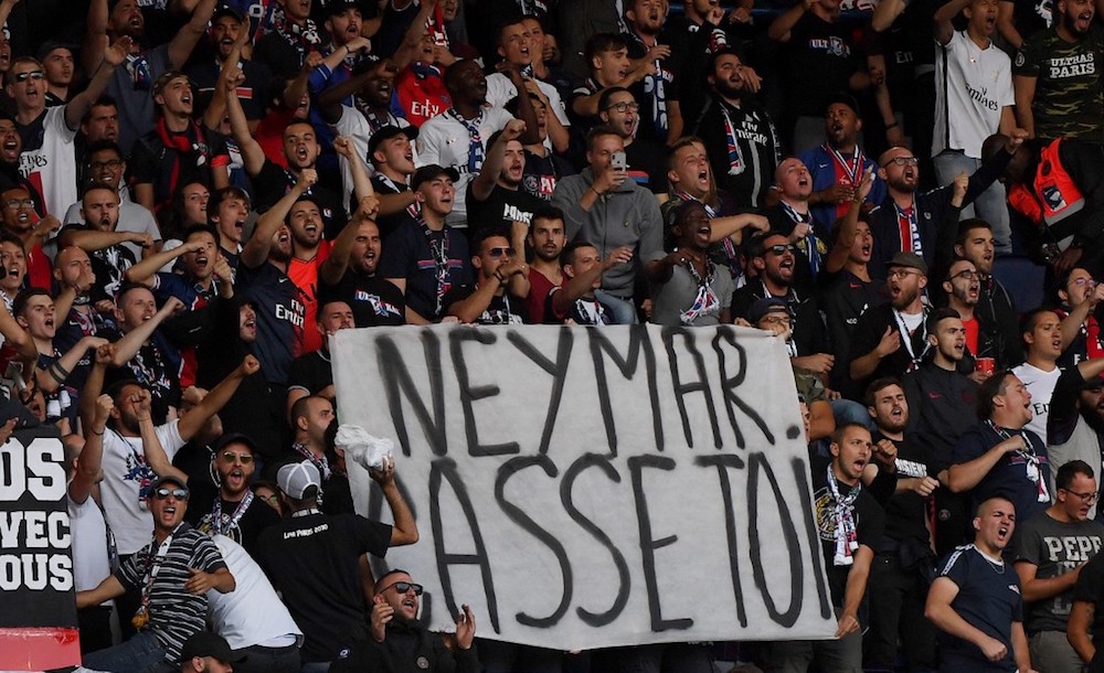 Paris Saint-Germainu00e2u20acu2122s supporters hold a banner reading u00e2u20acu02dcNeymar, buzz off!u00e2u20acu2122 prior to the French L1 match with Nimes Olympique at the Parc des Princes stadium in Paris August 11, 2019. u00e2u20acu201d AFP pic