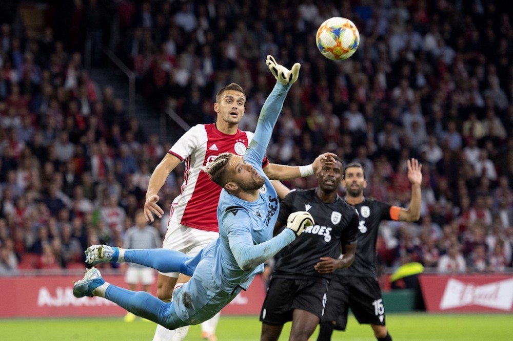 PAOK Salonikiu00e2u20acu2122s goalkeeper Alexandros Paschalakis stops a shot from Ajax Amsterdamu00e2u20acu2122s Dusan Tadic during their Uefa Champions League third preliminary round match in Amsterdam August 13, 2019. u00e2u20acu201d AFP pic