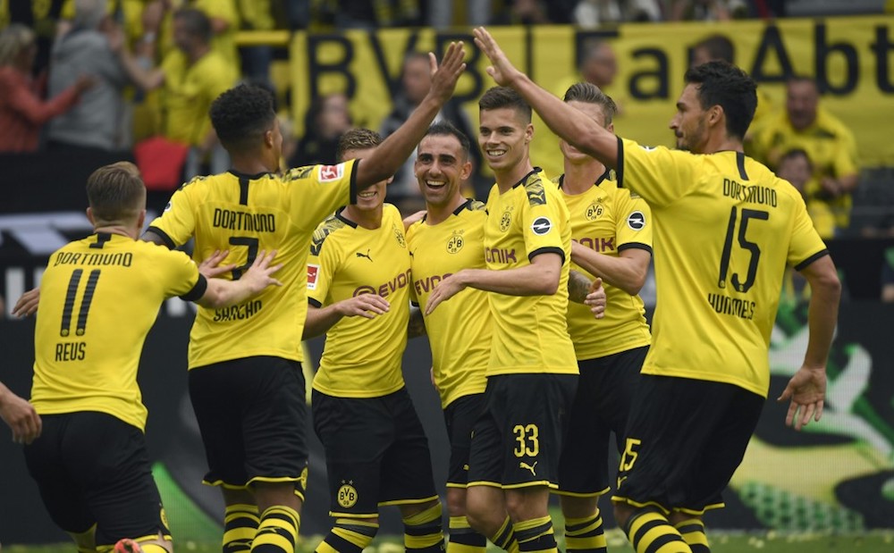 Dortmundu00e2u20acu2122s players celebrate a goal by Paco Alcacer during the Bundesliga match with Augsburg in Dortmund August 17, 2019. u00e2u20acu201d AFP pic