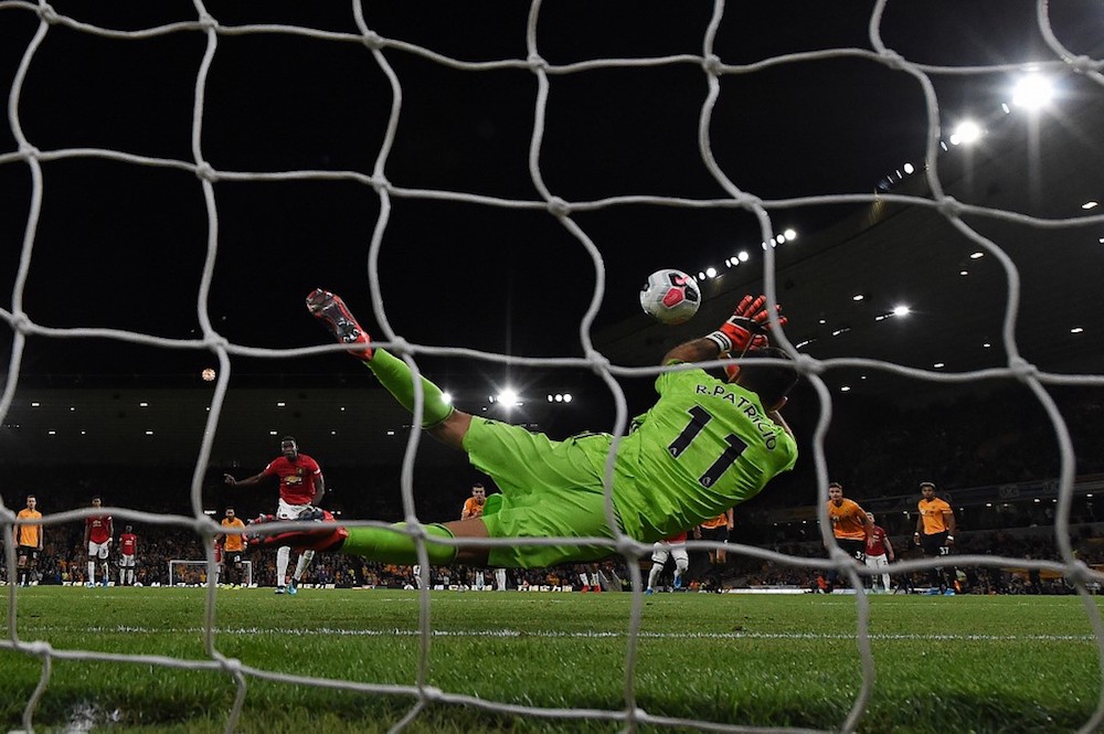 Wolverhampton Wanderersu00e2u20acu2122 goalkeeper Rui Patricio saves a penalty shot from Manchester Unitedu00e2u20acu2122s Paul Pogba during their Premier League match at the Molineux stadium in Wolverhampton August 19, 2019. u00e2u20acu201d AFP pic
