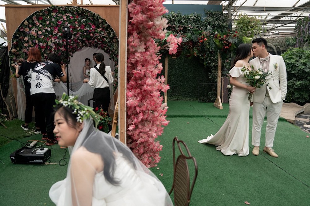 Couples pose in two different pre-wedding photo shoots at the Love Story in Rome Studio in Beijing June 5, 2019. — AFP pic