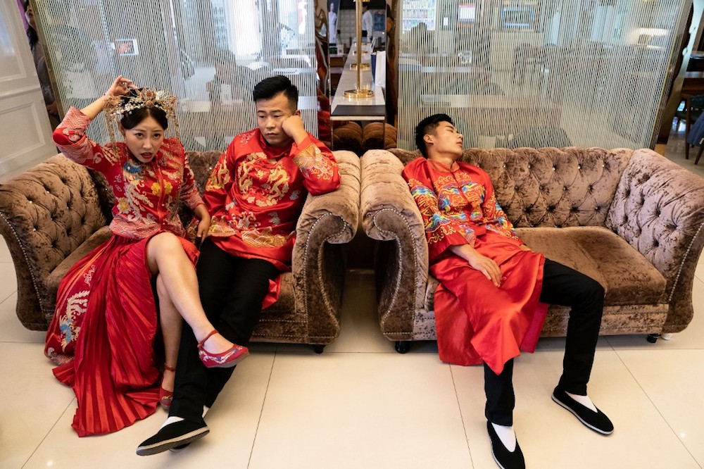Couples wait for their turn for their pre-wedding photo shoot at the Love Story in Rome Studio in Beijing June 25, 2019. — AFP pic