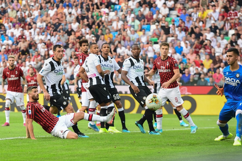 AC Milanu00e2u20acu2122s Italian defender Mateo Musacchio (Bottom left) misses a goal opportunity during the Italian Serie A football match against Udinese at the Friuli stadium in Udine August 25, 2019.  u00e2u20acu201d AFP pic