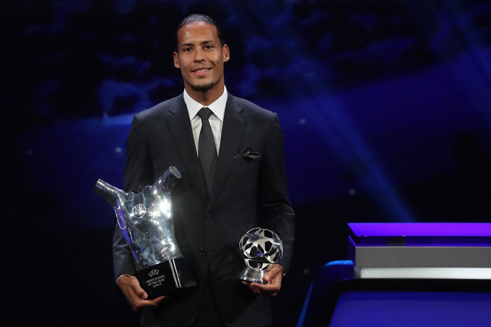Liverpoolu00e2u20acu2122s Virgil van Dijk poses with his trophies of Best Menu00e2u20acu2122s player in Europe of the Year and Best Defender at the end of the Uefa Champions League group stage draw ceremony in Monaco August 29, 2019. u00e2u20acu201d AFP pic