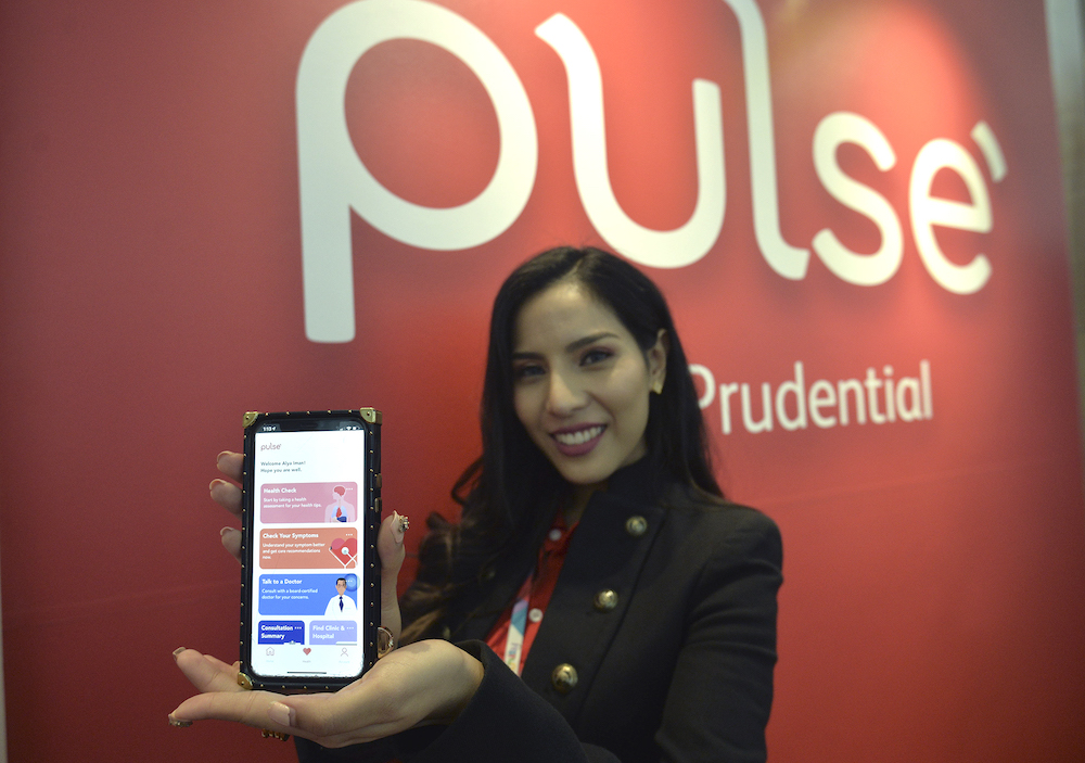 Prudential medical business management, Alya Iman Abdul Manab poses with the Pulse app at Le Meridien hotel in Putrajaya August 8, 2019. u00e2u20acu201d Picture by Shafwan Zaidon