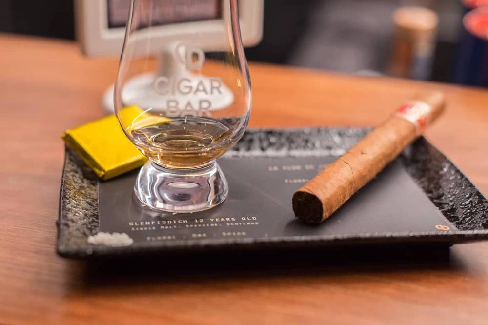 Each curated pairing option comes with a cigar, 30ml dram of whisky or rum, dark chocolate and French sea salt. — Picture courtesy of Cigar Bar 