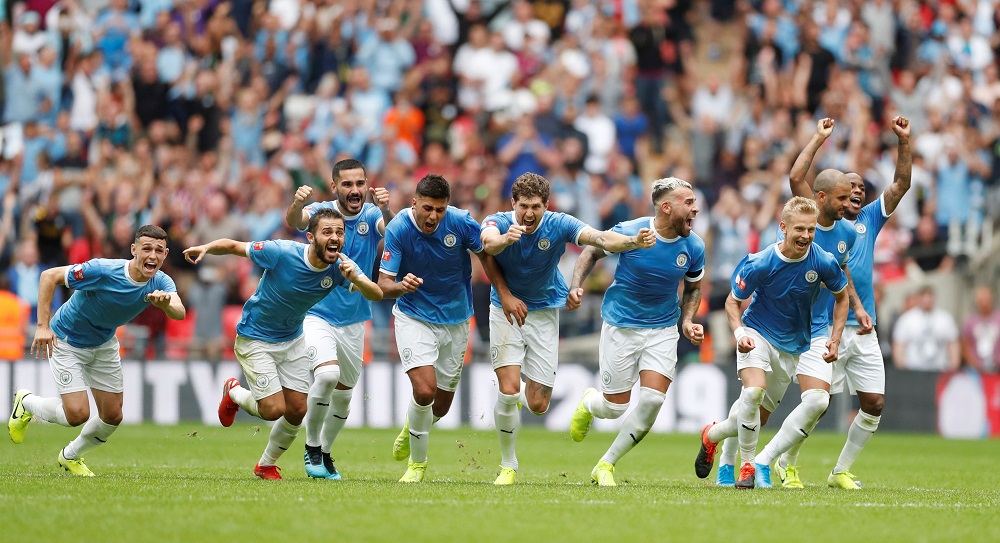 Manchester City players celebrate winning the FA Community Shield after a penalty shootout against Liverpool at the Wembley Stadium in London August 4, 2019.u00e2u20acu201dAction Images via Reuters