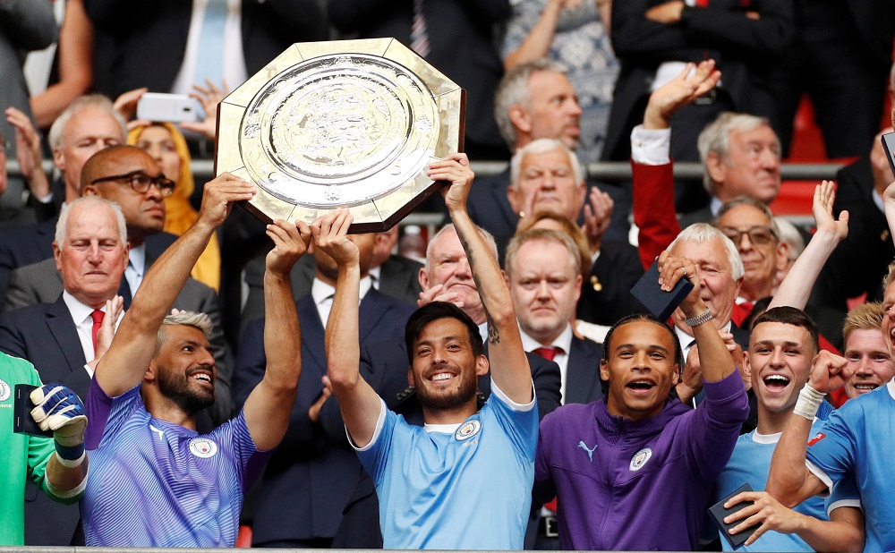 Manchester Cityu00e2u20acu2122s Sergio Aguero and David Silva celebrate winning the FA Community Shield with team mates at the Wembley Stadium in London August 4, 2019. u00e2u20acu201d Action Images via Reuters