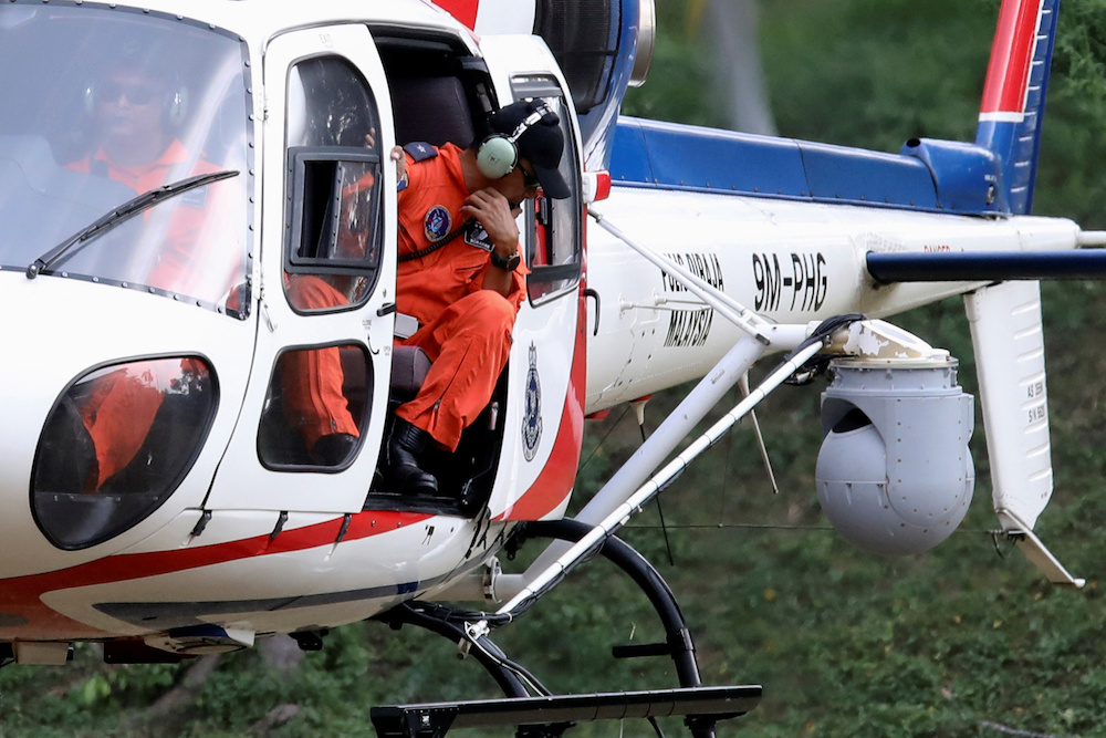 A helicopter from the Malaysian Police Air Wing Unit, equipped with a surveillance thermal imaging camera, participates in a search and rescue operation for 15-year-old Irish girl Nora Anne Quoirin in Seremban August 8, 2019. — Reuters pic