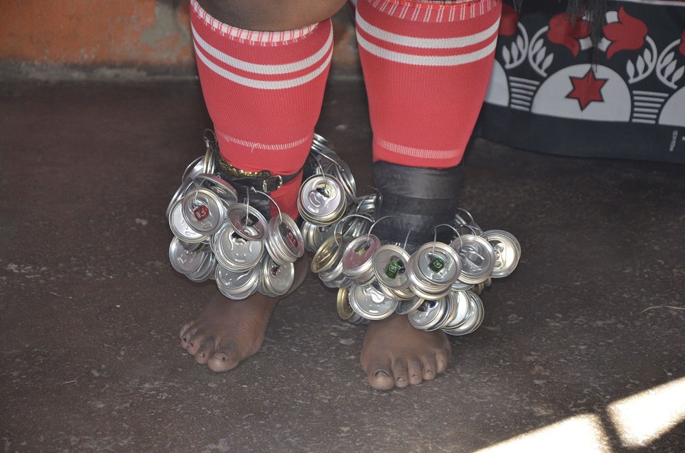 Badanile Maci adorns her feet with the tops of cans, used to create sound during her traditional dancing ceremonies in Johannesburg, South Africa June 7, 2019. — Thomson Reuters Foundation pic
