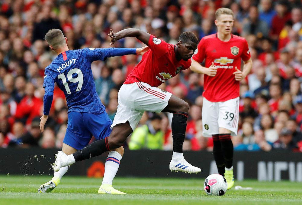 Manchester Unitedu00e2u20acu2122s Paul Pogba in action with Chelseau00e2u20acu2122s Mason Mount during their English Premier League match at Old Trafford in Manchester August 11, 2019. u00e2u20acu201d Reuters pic