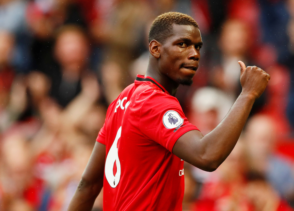 Manchester Unitedu00e2u20acu2122s Paul Pogba gestures to the fans after the English Premier League match with Chelsea at Old Trafford in Manchester August 11, 2019. u00e2u20acu201d Action Images pic via Reuters