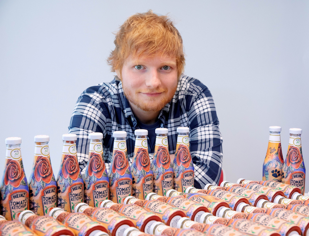 Ed Sheeran poses with bottles of Heinz Tomato Ketchup based on his tattoos in London May 20, 2019. u00e2u20acu201d Reuters pic