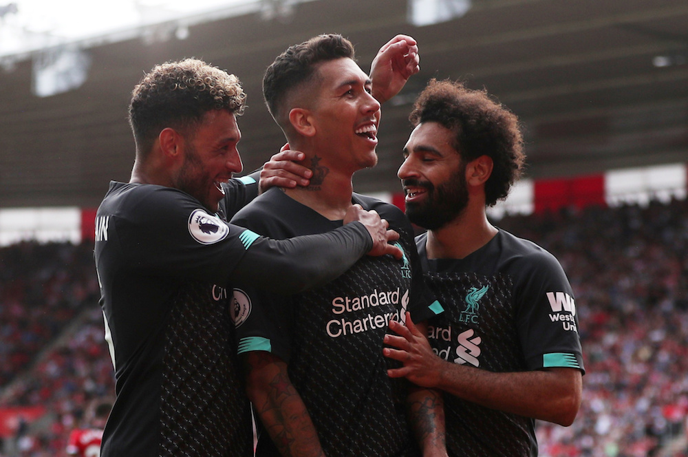 Liverpoolu00e2u20acu2122s Roberto Firmino celebrates scoring their second goal with teammates Alex Oxlade-Chamberlain and Mohamed Salah during their Premier League match with Southampton at St Maryu00e2u20acu2122s Stadium in Southampton August 17, 2019. u00e2u20acu201d Reuters pic