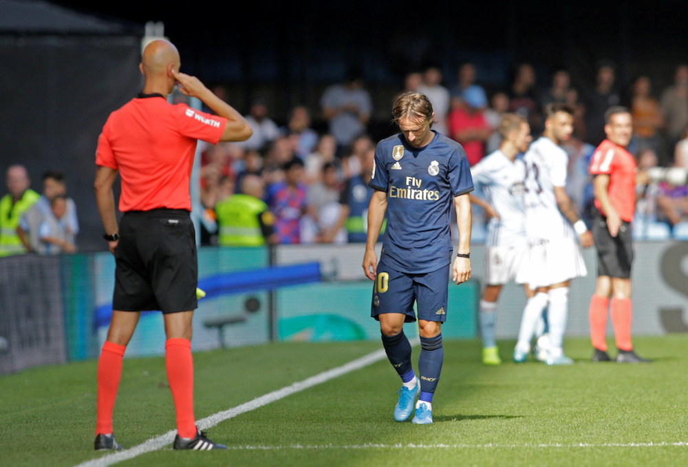 Real Madridu00e2u20acu2122s Luka Modric walks off the pitch after being sent off by referee Javier Fernandez during the La Liga match with Celta Vigo at Balaidos in Vigo August 17, 2019. u00e2u20acu201d Reuters pic