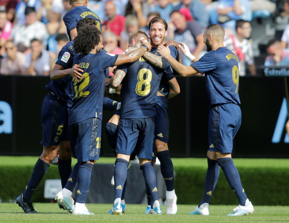 Real Madrid’s Toni Kroos celebrates scoring their second goal with teammates during the La Liga match with Celta Vigo at Balaidos in Vigo August 17, 2019. — Reuters pic