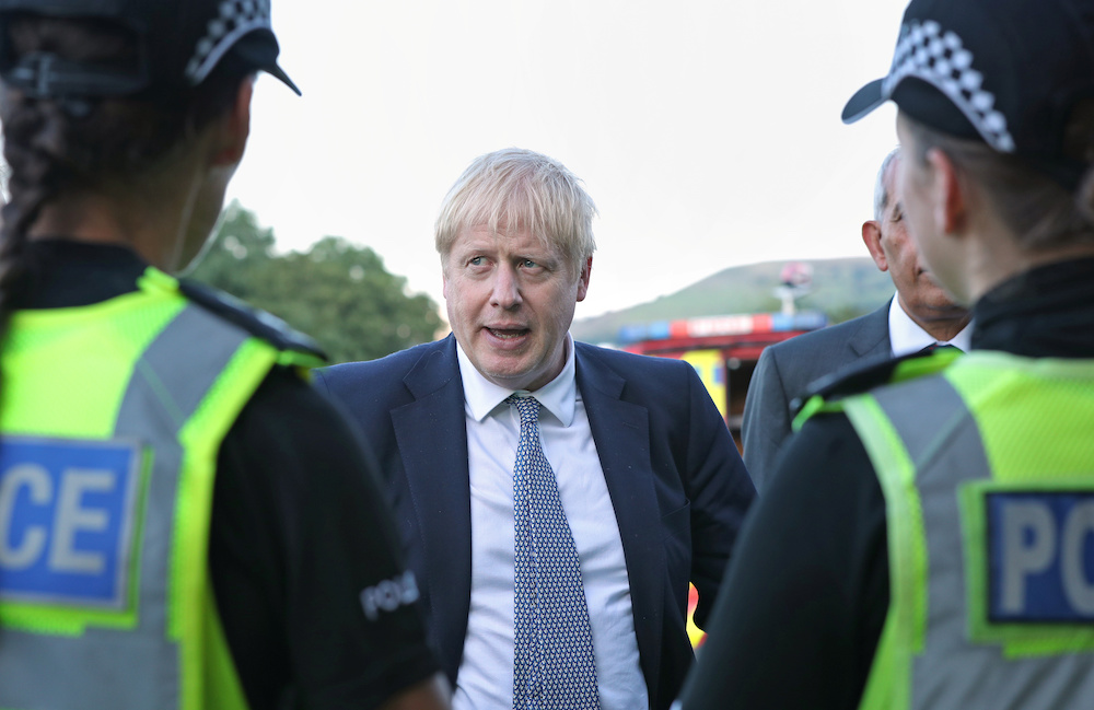 Britain's Prime Minister Boris Johnson meets police officers during a visit to Whaley Bridge Football Club in Derbyshire in Britain August 2, 2019. u00e2u20acu201d Reuters pic