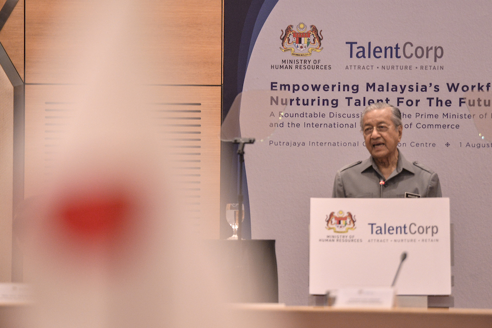 Prime Minister Tun Dr Mahathir Mohamad delivers his speech during a roundtable discussion with international chambers of commerce at the Putrajaya International Convention Centre August 1, 2019. u00e2u20acu201d Picture by Shafwan Zaidon
