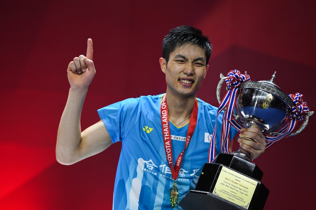 Taiwan's Chou Tien Chen poses with the trophy during the award presentation after the men;s singles final match against Hong Kong's Ng Kang Long Angus at the Thailand Open badminton tournament in Bangkok on August 4, 2019. u00e2u20acu201d AFP picnn