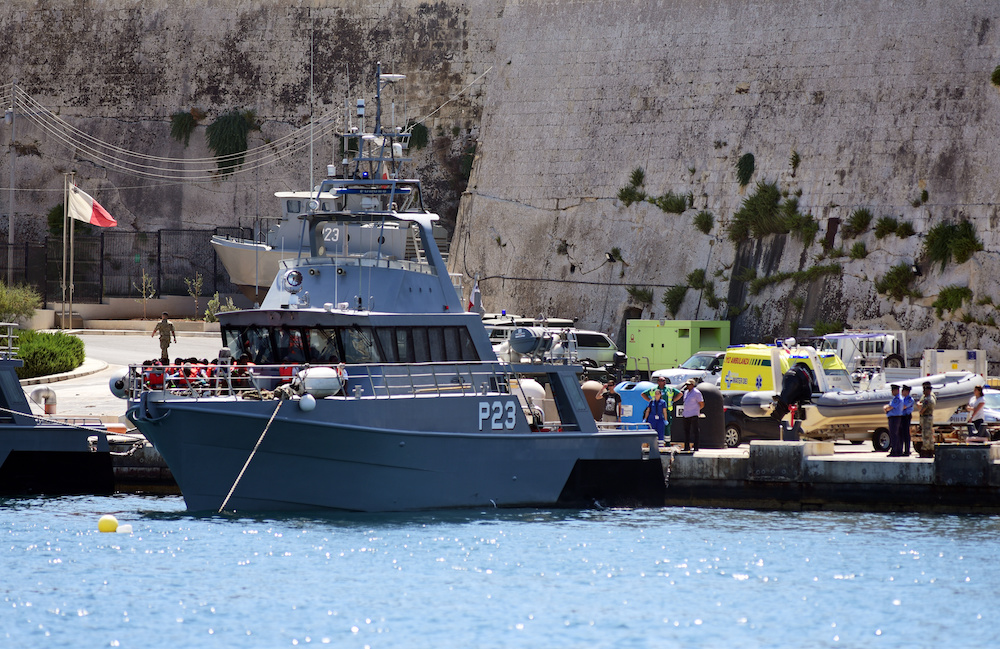 Migrants get ready to disembark from a Maltese Patrol boat after they were transferred from the rescue vessel Alan kurdi, at the maritime base in Pieta, Malta August 4, 2019. u00e2u20acu201d Reuters pic