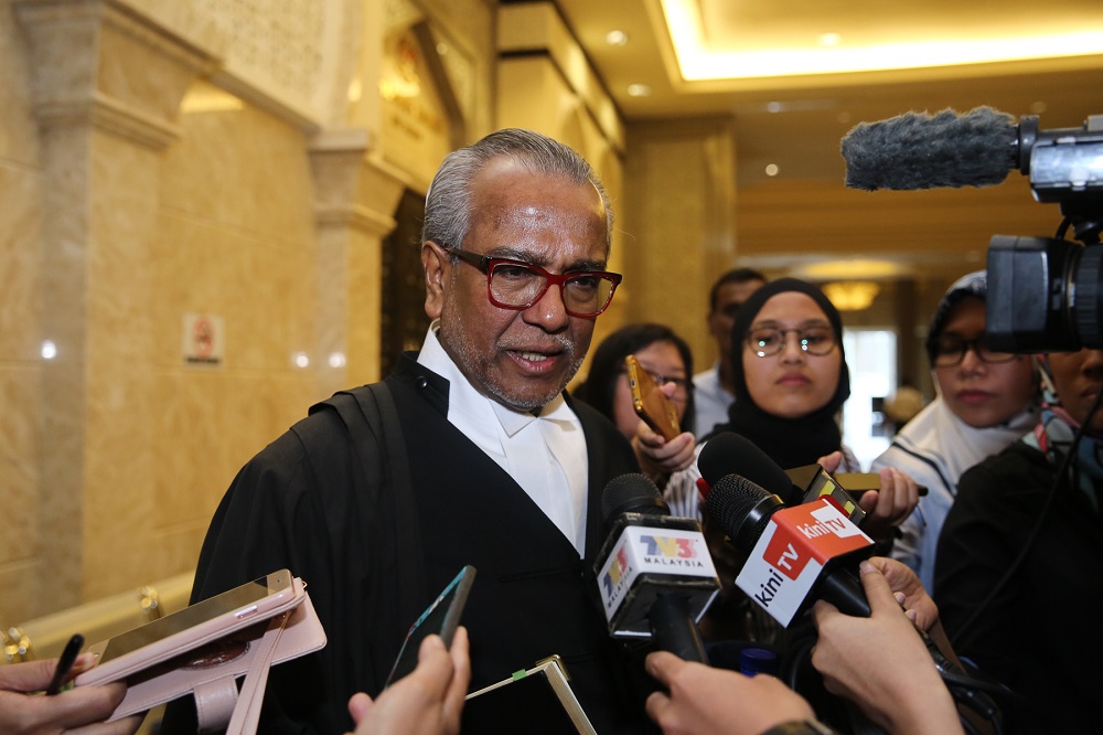 Datuk Seri Najib Razak’s lawyer Tan Sri Muhammad Shafee Abdullah speaks to reporters at the Palace of Justice in Putrajaya August 5, 2019. — Picture by Yusof Mat Isa