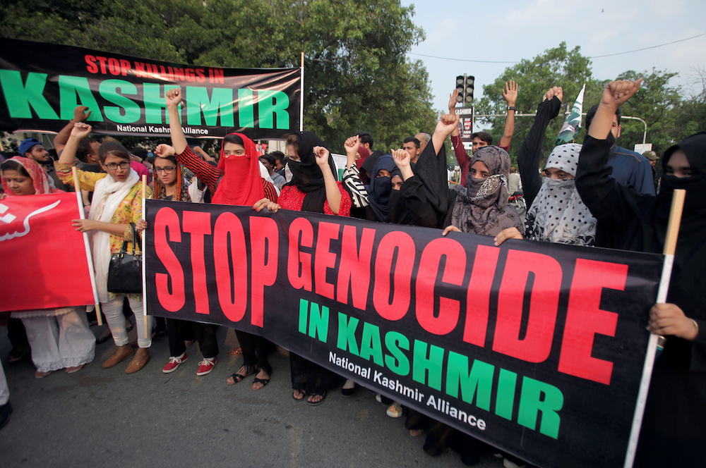 People hold banners and chant slogans during a rally in solidarity with the people of Kashmir, in Lahore August 5, 2019. u00e2u20acu201d Reuters pic