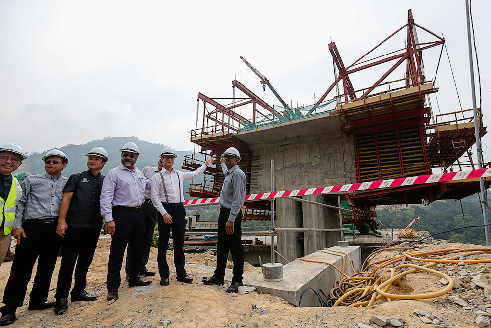 State excos Zairil Khir Johari and Jagdeep Singh Deo and MBPP Mayor Datuk Yew Tung Seang visit the site of the Bukit Kukus Paired Road construction in George Town August 7, 2019. u00e2u20acu201d Picture by Sayuti Zainudin