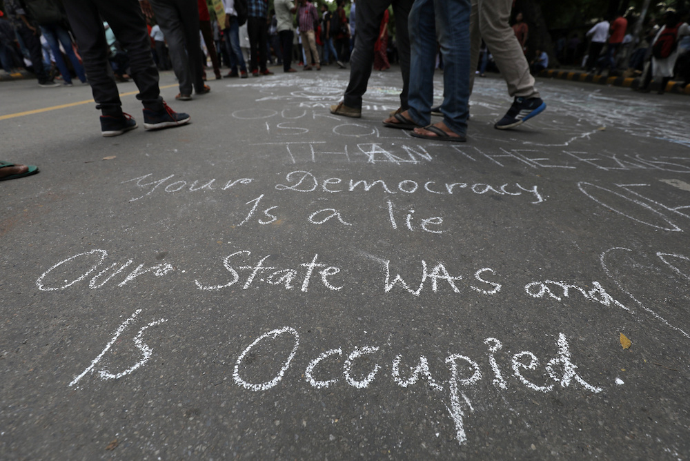 People stand on a road after a protest against the scrapping of the special constitutional status for Kashmir by the government, in New Delhi August 7, 2019.u00e2u20acu201d Reuters pic