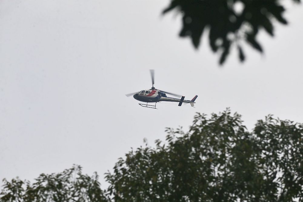 A helicopter equipped with a thermal camera is seen in the jungle above The Dusun in Seremban August 8, 2019. — Picture by Ahmad Zamzahuri