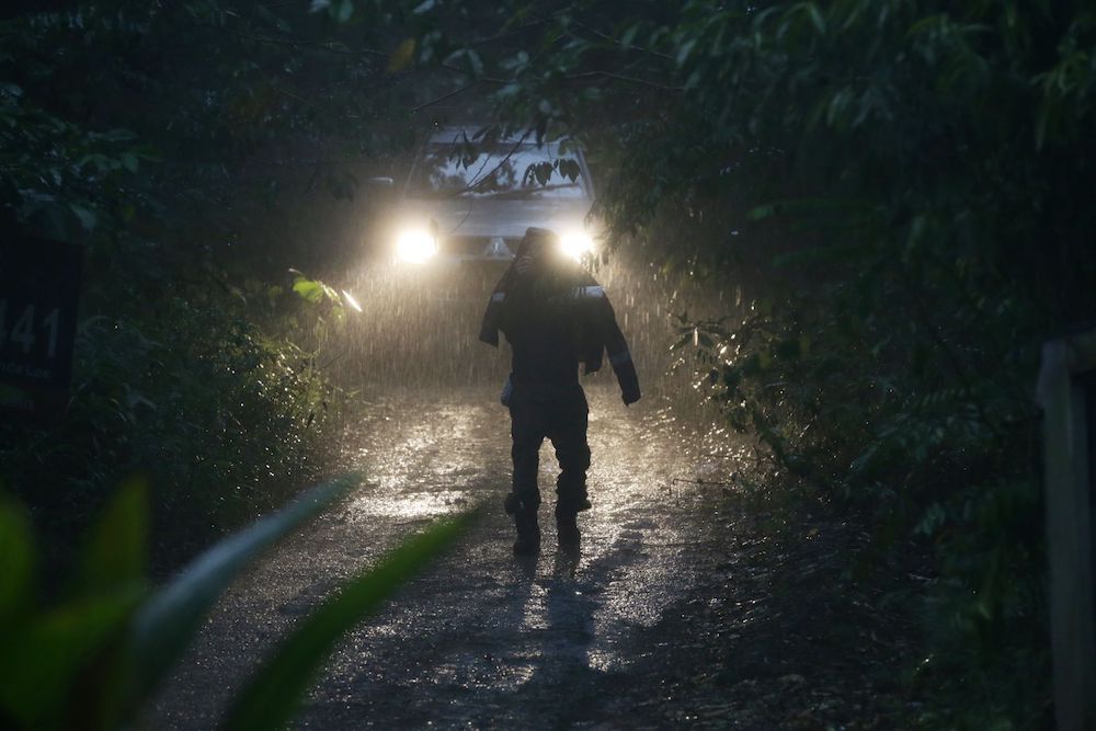 A rescuer continues the search for missing Irish girl Nora Anne Quoirin in the jungle near Seremben August 8, 2019, despite a heavy downpour. — Picture by Ahmad Zamzahuri
