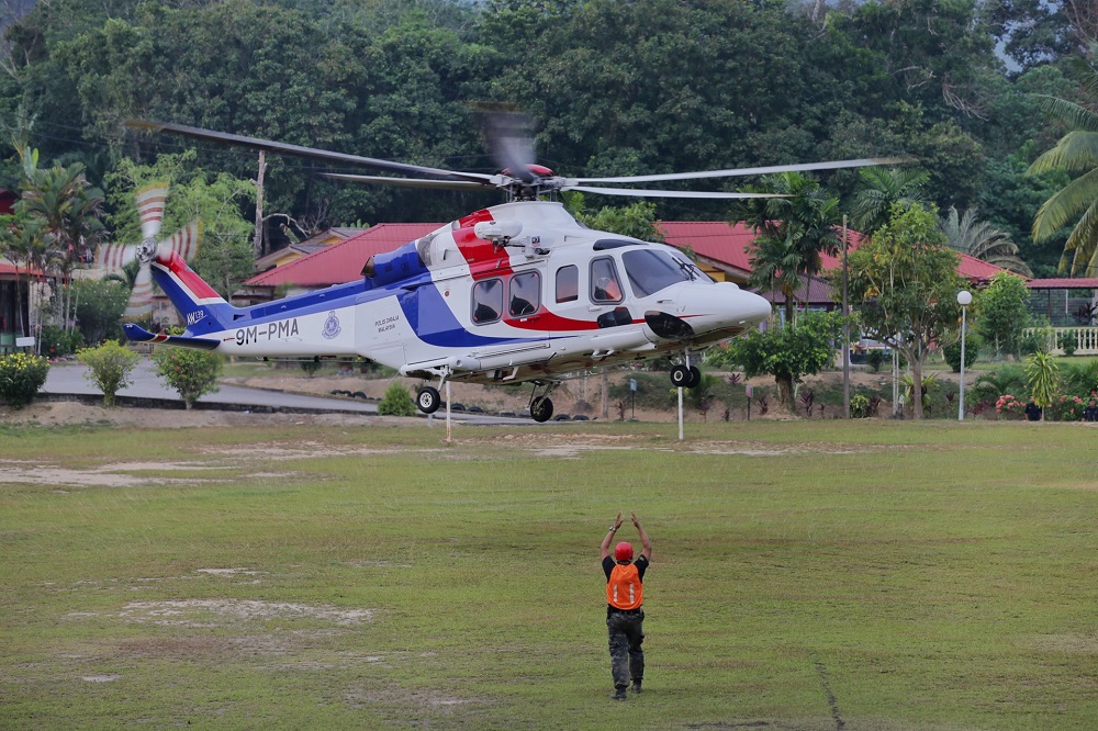 A police helicopter arrives to retrieve a body that was found in the jungle near Seremban August 13, 2019. — Picture by Ahmad Zamzahuri