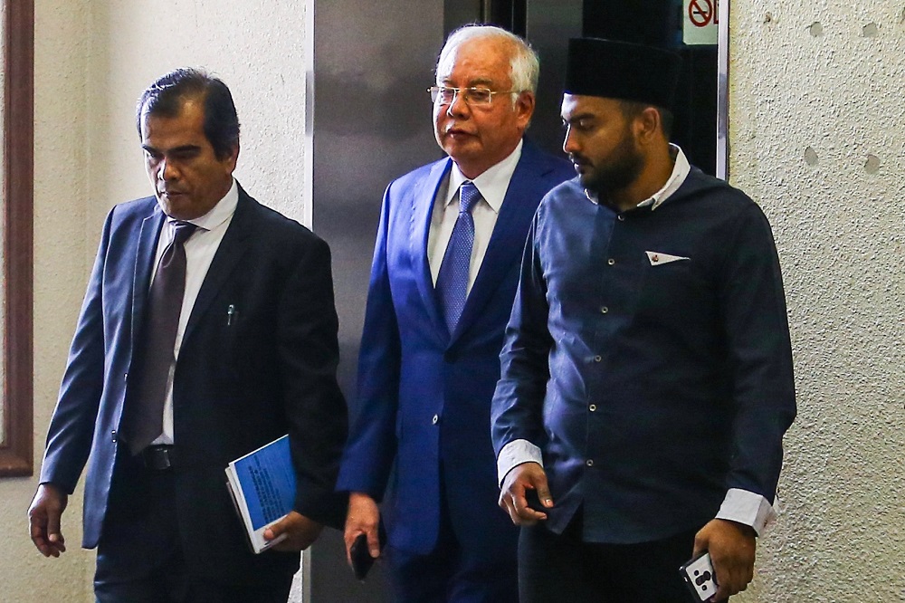 Datuk Seri Najib Razak leaves the courtroom at the Kuala Lumpur Court Complex August 13, 2019. — Picture by Hari Anggara
