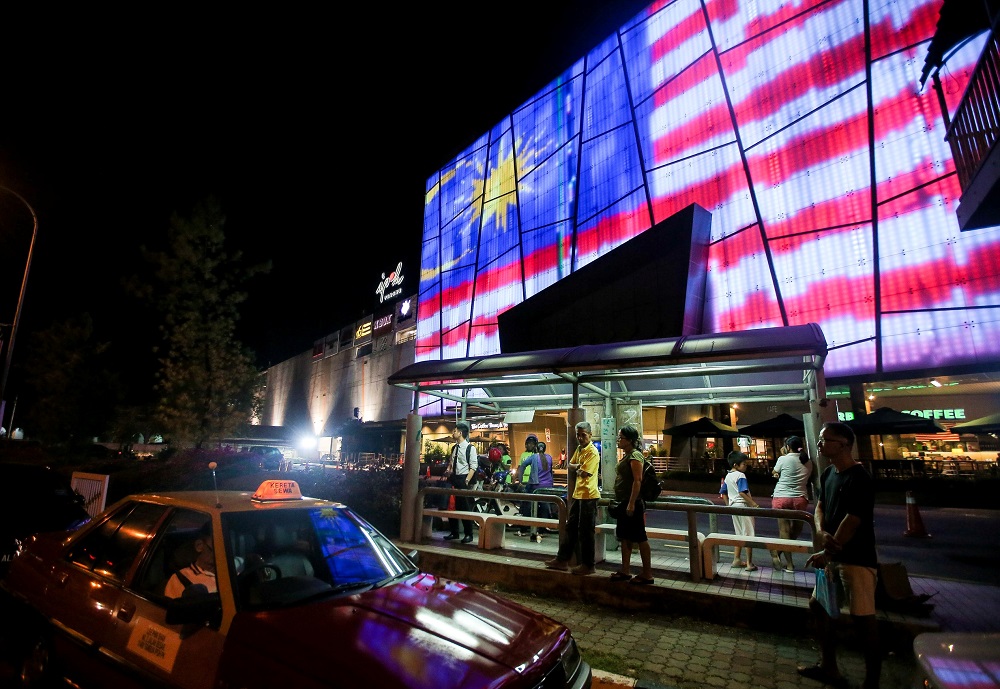 A large LED screen featuring the Jalur Gemilang is displayed along Jalan Sultan Idris Shah in conjunction with Merdeka August 15, 2019. u00e2u20acu201d Picture by Farhan Najib